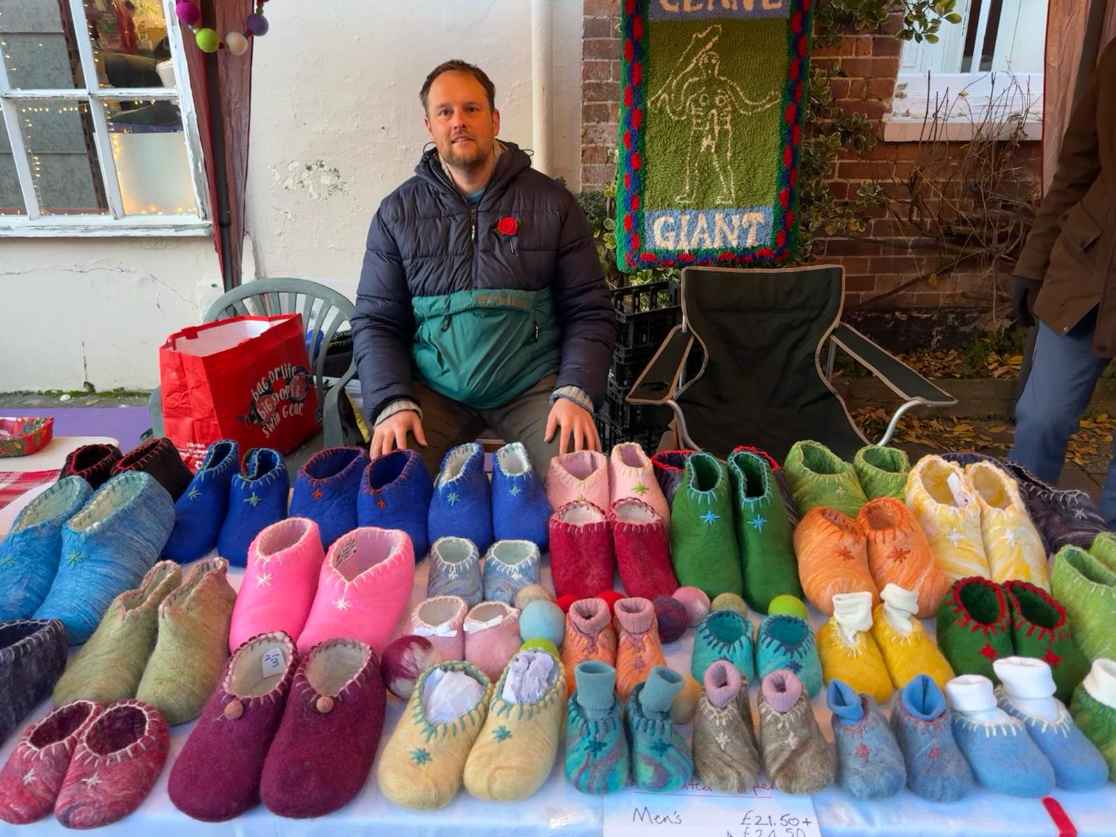 Picture of Tom Best selling slippers at a craft fair